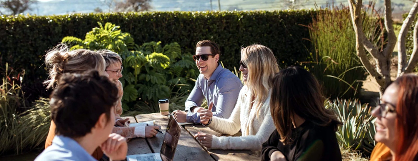 Small group in conversation outdoors